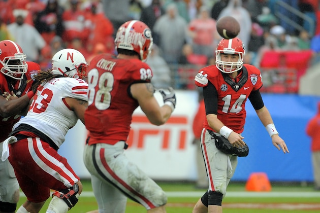 Georgia quarterback Hutson Mason (14) throws a pass to tight end Arthur Lynch (88) during the first half of the Gator Bowl NCAA college football game against Nebraska, Wednesday, Jan. 1, 2014, in Jacksonville, Fla. (AP Photo/Stephen B. Morton)