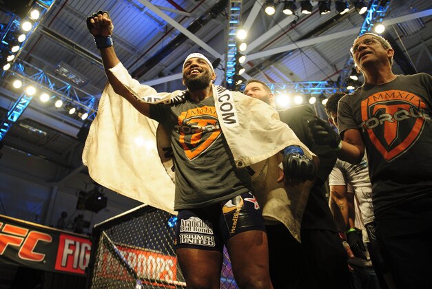 Nov 6, 2013; Fort Campbell, KY, USA; Yoel Romero (blue gloves) reacts to his win against Rony Markes (red gloves) in the middleweight bout during UFC Fight for the Troops at Fort Campbell. Mandatory Credit: Joshua Lindsey-USA TODAY Sports