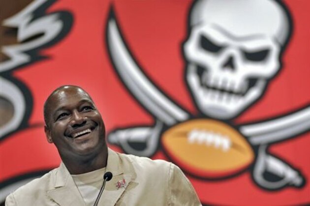 FILE - In this May 6, 2014 file photo, former Tampa Bay Buccaneers linebacker Derrick Brooks smiles as he answers a question during a news conference in Tampa, Fla., Brooks will be inducted into the Pro Football Hall of Fame Saturday, Aug. 2, 2014, in Canton, Ohio. (AP Photo/Chris O'Meara, File)