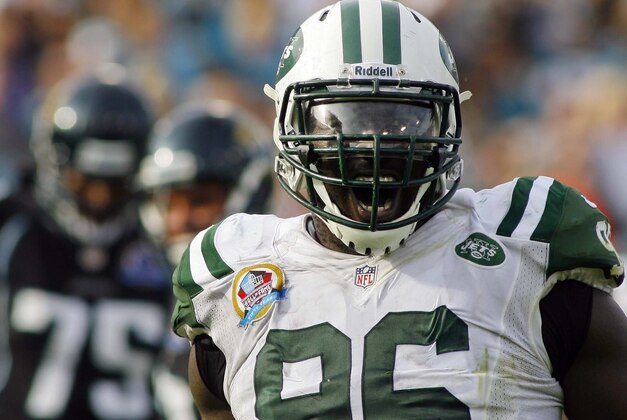 Dec 9, 2012; Jacksonville FL, USA; New York Jets defensive end Muhammad Wilkerson (96) celebrates sacking Jacksonville Jaguars quarterback Chad Henne (not pictured) in the third quarter of their game at EverBank Field. The New York Jets beat the Jacksonville Jaguars 17-10. Mandatory Credit: Phil Sears-USA TODAY Sports