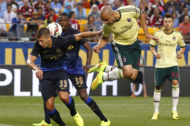 PITTSBURGH, PA - JULY 27:  Alex Rodrigo Dias da Costa #33 of AC Milan heads a ball in the first half against Matija NastasiÄ #33 of Manchester City during International Champions Cup 2014 at Heinz Field on July 27, 2014 in Pittsburgh, Pennsylvania.  (Photo by Justin K. Aller/Getty Images)