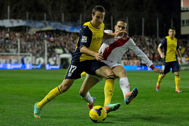MADRID, SPAIN - JANUARY 26: Javier Manquillo (L) of Atletico de Madrid competes for the ball with Jose Ignacio Martinez alias Nacho (R) of Rayo Vallecano de Madrid during the La Liga match between Rayo Vallecano de Madrid and Club Atletico de Madrid at Estadio de Vallecas on January 26, 2014 in Madrid, Spain.  (Photo by Gonzalo Arroyo Moreno/Getty Images)