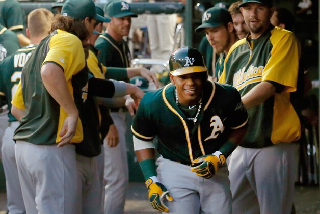 ARLINGTON, TX - JULY 26:  Yoenis Cespedes #52 of the Oakland Athletics celebrates after hitting a solo home run against the Texas Rangers in the top of the sixth inning at Globe Life Park in Arlington on July 26, 2014 in Arlington, Texas.  (Photo by Tom Pennington/Getty Images)