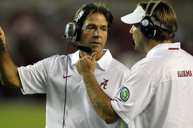 Alabama head coach Nick Saban talks with defensive coordinator Kirby Smart after a targeting call against one of Alabama's defenders during the second half of an NCAA college football game against Mississippi on Saturday, Sept. 28, 2013, in Tuscaloosa, Ala. (AP Photo/Butch Dill)