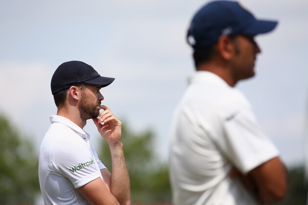SOUTHAMPTON, ENGLAND - JULY 31:  Man of the match James Anderson (L) of England with match bowling figures of 7 for 77 waits alongside MS Dhoni the captain of India at the end of match presentations during day five of the 3rd Investec Test match between England and India at the Ageas Bowl on July 31, 2014 in Southampton, England.  (Photo by Michael Steele/Getty Images)