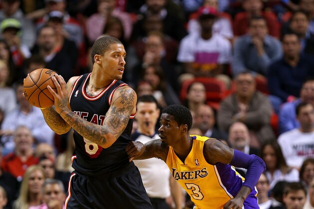 MIAMI, FL - JANUARY 23: Michael Beasley #8 of the Miami Heat posts up Manny Harris #3 of the Los Angeles Lakers during a game  at American Airlines Arena on January 23, 2014 in Miami, Florida. NOTE TO USER: User expressly acknowledges and agrees that, by downloading and/or using this photograph, user is consenting to the terms and conditions of the Getty Images License Agreement. Mandatory copyright notice:  (Photo by Mike Ehrmann/Getty Images)
