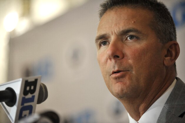 Ohio State head coach Urban Meyer talks to the media during the Big Ten Football Media Day in Chicago, Monday, July 28, 2014. (AP Photo/Paul Beaty)