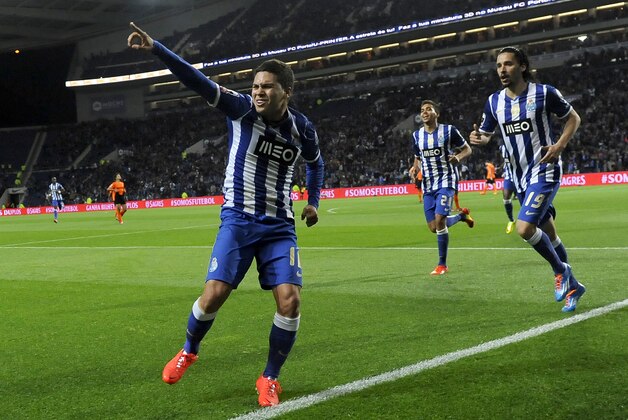 FC Porto's Juan Quintero, left, from Colombia celebrates after scoring against Belenenses in a Portuguese League soccer match at the Dragao stadium in Porto, Portugal, Sunday, March 23, 2014. Quintero scored the only goal in Porto's 1-0 victory. (AP Photo/Paulo Duarte)