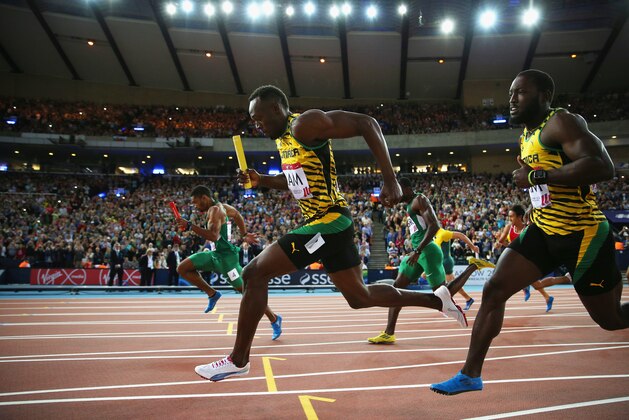 GLASGOW, SCOTLAND - AUGUST 01:  Usain Bolt competes in the Men's 4x100 metres relay heats at Hampden Park during day nine of the Glasgow 2014 Commonwealth Games on August 1, 2014 in Glasgow, United Kingdom.  (Photo by Hannah Peters/Getty Images)