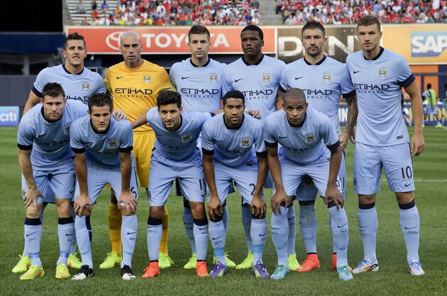 Manchester City players pose for a team photo before playing against Liverpool in a Guinness International Champions Cup soccer tournament match, Wednesday, July 30, 2014, at Yankee Stadium in New York. (AP Photo/Julie Jacobson)