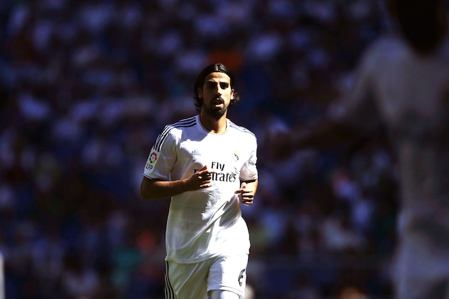 Real Madrid's Sami Khedira from Germany runs during a Spanish La Liga soccer match between Real Madrid and Espanyol at the Santiago Bernabeu stadium  in Madrid, Spain, Saturday, May 17, 2014 . (AP Photo/Daniel Ochoa de Olza)
