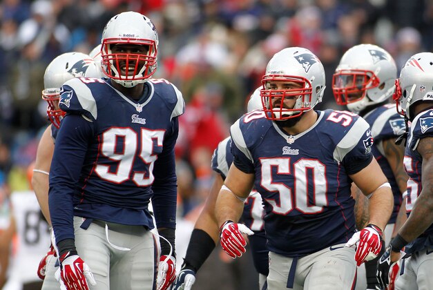 Dec 8, 2013; Foxborough, MA, USA; New England Patriots defensive end Chandler Jones (95) and defensive end Rob Ninkovich (50) during the second quarter against the Cleveland Browns at Gillette Stadium. Mandatory Credit: Stew Milne-USA TODAY Sports