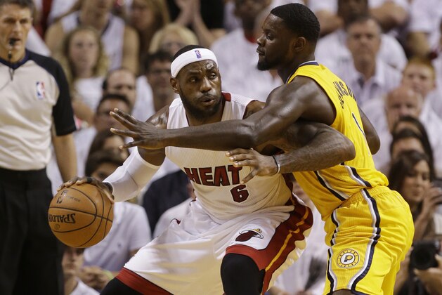Indiana Pacers guard Lance Stephenson (1) defends Miami Heat forward LeBron James (6) during the first half Game 6 in the NBA basketball playoffs Eastern Conference finals on Friday, May 30, 2014, in Miami. (AP Photo/Lynne Sladky)