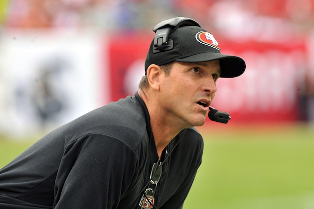 TAMPA, FL - DECEMBER 15: Coach Jim Harbaugh of the San Francisco 49ers watches play against the Tampa Bay Buccaneers December 15, 2013 at Raymond James Stadium in Tampa, Florida. The 49ers won 33 - 14. (Photo by Al Messerschmidt/Getty Images) TAMPA, FL - DECEMBER 15: Coach Jim Harbaugh of the San Francisco 49ers watches play against the Tampa Bay Buccaneers December 15, 2013 at Raymond James Stadium in Tampa, Florida. The 49ers won 33 - 14. (Photo by Al Messerschmidt/Getty Images)