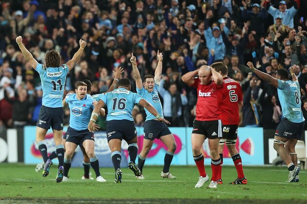 SYDNEY, AUSTRALIA - AUGUST 02: Waratahs players celebrate victory at the end of the Super Rugby Grand Final match between the Waratahs and the Crusaders at ANZ Stadium on August 2, 2014 in Sydney, Australia.  (Photo by Mark Metcalfe/Getty Images)