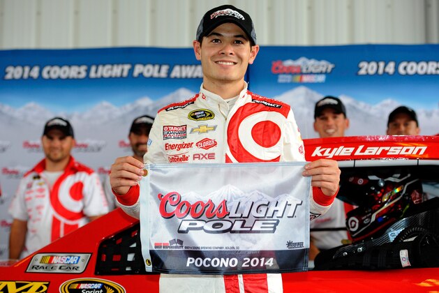 LONG POND, PA - AUGUST 01:  Kyle Larson, driver of the #42 Target Chevrolet, poses with the Coors Light Pole Award after qualifying for the NASCAR Sprint Cup Series GoBowling.com 400 at Pocono Raceway on August 1, 2014 in Long Pond, Pennsylvania.  (Photo by Jared C. Tilton/Getty Images)