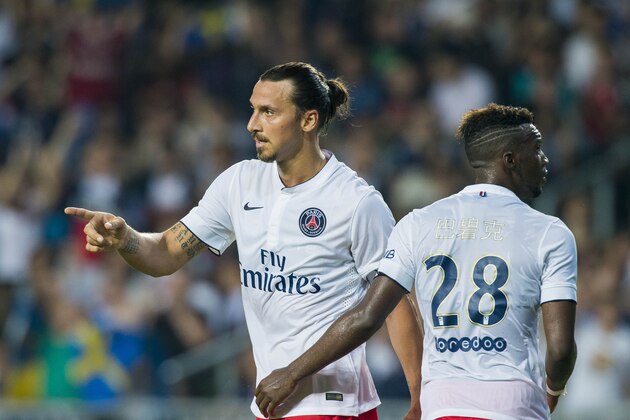 HONG KONG - JULY 29:  Zlatan Ibrahimovic (L) celebrates with Jean-Christophe Bahebeck of Paris Saint-Germain after scoring a goal during the friendly match between Kitchee and Paris Saint-Germain at Hong Kong Stadium on July 29, 2014 in Hong Kong, Hong Kong.  (Photo by Victor Fraile/Getty Images)