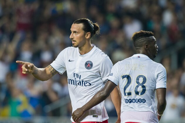HONG KONG - JULY 29:  Zlatan Ibrahimovic (L) celebrates with Jean-Christophe Bahebeck of Paris Saint-Germain after scoring a goal during the friendly match between Kitchee and Paris Saint-Germain at Hong Kong Stadium on July 29, 2014 in Hong Kong, Hong Kong.  (Photo by Victor Fraile/Getty Images)