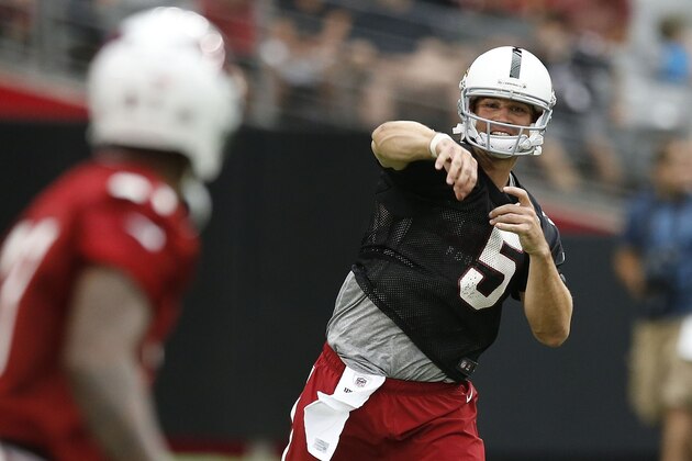 Arizona Cardinals' Drew Stanton (5) throws the ball during the first day of NFL football training camp on Saturday, July 26, 2014, in Glendale, Ariz. (AP Photo/Ross D. Franklin)