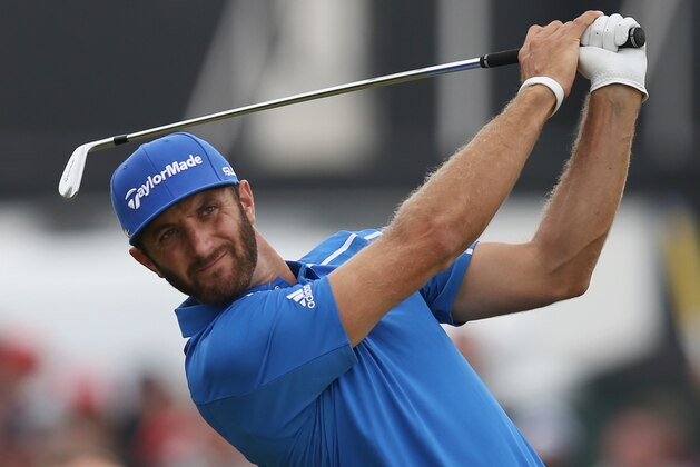 Dustin Johnson of the US plays his shot from the 4th tee during the final round of the British Open Golf championship at the Royal Liverpool golf club, Hoylake, England, Sunday July 20, 2014. (AP Photo/Scott Heppell)