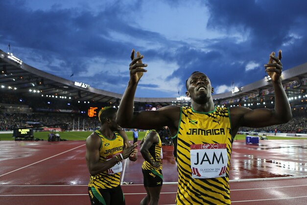 Jamaica's Usain Bolt celebrates after anchoring the Jamaican team to the gold medal in the Men's 4x100m relay at Hampden Park Stadium during the Commonwealth Games 2014 in Glasgow, Scotland, Saturday Aug. 2, 2014. (AP Photo/Frank Augstein)