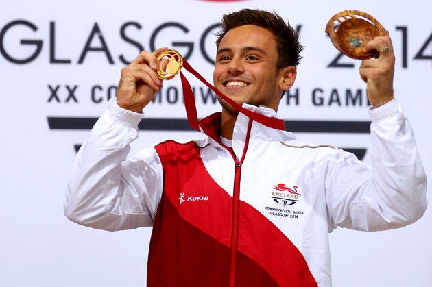 EDINBURGH, SCOTLAND - AUGUST 02:  Tom Daley of England celebrates on the podium after winning the Gold medal in the Men's 10m Platform Final at the Royal Commonwealth Pool during day ten of the Glasgow 2014 Commonwealth Games on August 2, 2014 in Edinburgh, United Kingdom.  (Photo by Clive Rose/Getty Images)