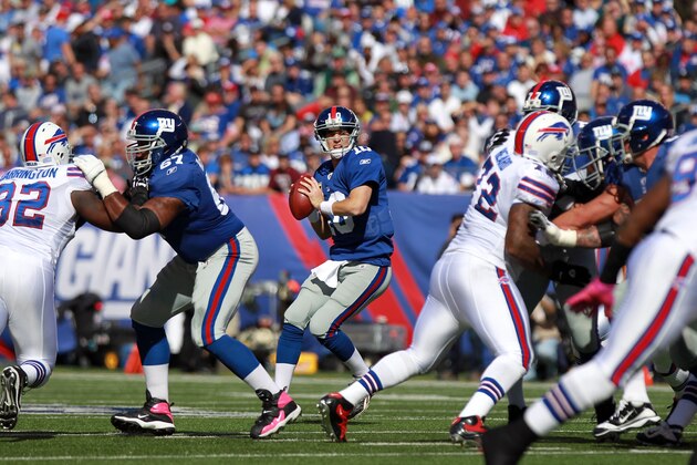 EAST RUTHERFORD, NJ - OCTOBER 16:  Eli Manning #10 of the New York Giants looks to pass against the Buffalo Bills at MetLife Stadium on October 16, 2011 in East Rutherford, New Jersey.  (Photo by Nick Laham/Getty Images)