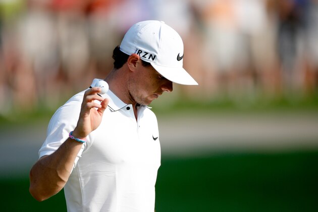 AKRON, OH - AUGUST 02: Rory McIlroy of Northern Ireland reacts after a putt on the first green during the third round of the World Golf Championships-Bridgestone Invitational at Firestone Country Club South Course on August 2, 2014 in Akron, Ohio.  (Photo by Gregory Shamus/Getty Images)