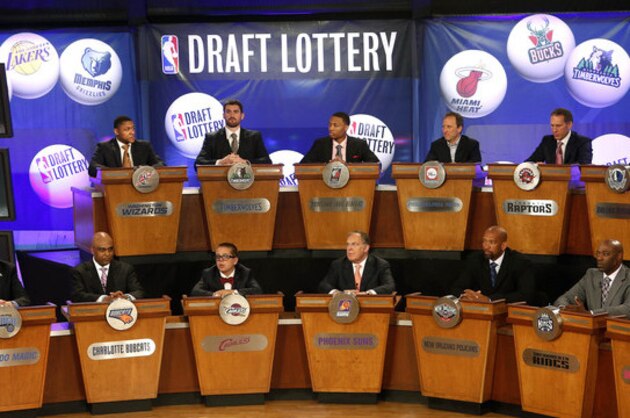 FILE - In this May 21, 2013 file photo, NBA basketball team representatives sit onstage at the start of the NBA draft lottery in New York. The draft lottery is Tuesday, May 20, 2014, a night some teams appeared to be aiming toward for months during a season featuring plenty of talking about tanking. The winner gets the No. 1 pick in next month's draft, when an Andrew Wiggins or Jabari Parker might make all of this season's misery worth it. (AP Photo/Jason DeCrow, File)