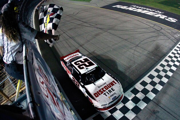 NEWTON, IA - AUGUST 02:  Brad Keselowski, driver of the #22 Discount Tire Ford, wins the Nationwide Series U.S. Cellular 250 at Iowa Speedway on August 2, 2014 in Newton, Iowa.  (Photo by Brian Lawdermilk/Getty Images)