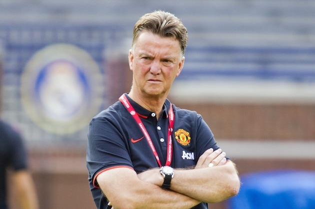 Manchester United manager Louis van Gaal watches his team during a training session, Friday, Aug. 1, 2014, at Michigan Stadium in Ann Arbor, Mich. Real Madrid will face Manchester United in a Guinness International Champions Cup match Saturday at this college football stadium. (AP Photo/Tony Ding)