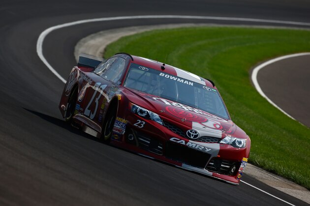 INDIANAPOLIS, IN - JULY 26:  Alex Bowman, driver of the #23 Dr. Pepper Toyota, practices for the NASCAR Sprint Cup Series Crown Royal Presents The John Wayne Walding 400 at the Brickyard Indianapolis Motor Speedway on July 26, 2014 in Indianapolis, Indiana.  (Photo by Chris Trotman/Getty Images)