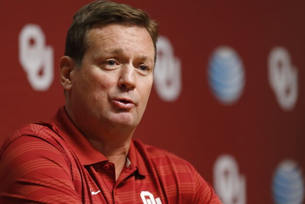 Oklahoma head coach Bob Stoops answers a question during Media Day in Norman, Okla., Saturday, Aug. 2, 2014. (AP Photo/Sue Ogrocki)
