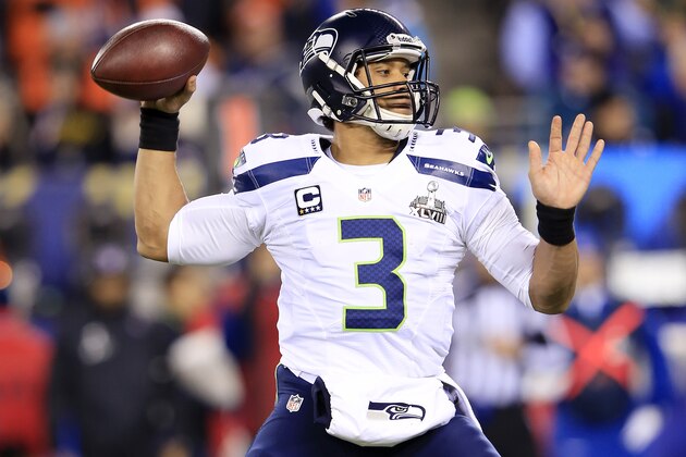 EAST RUTHERFORD, NJ - FEBRUARY 02: Quarterback Russell Wilson #3 of the Seattle Seahawks looks to pass against the Denver Broncos during Super Bowl XLVIII at MetLife Stadium on February 2, 2014 in East Rutherford, New Jersey. Seattle Seahawks won 43-8. (Photo by Jamie Squire/Getty Images)