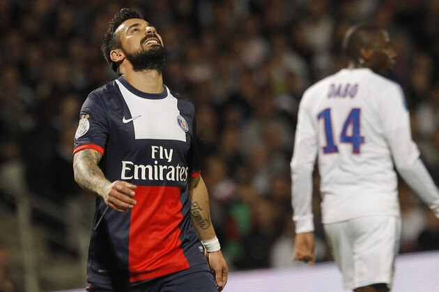 Paris Saint Germain's Ezequiel Lavezzi, left, reacts during their French League One soccer match against Lyon, in Lyon, central France, Sunday, April 13, 2014. (AP Photo/Laurent Cipriani)