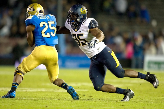 This Oct. 12, 2013 photo released by GoldenBearSports.com shows California's Ted Agu, right, tackling UCLA's Damien Thigpen, in Pasadena, Calif. Agu died Friday morning, Feb. 7, 2014. He was 21. The school announced Agu's death and said its thoughts and prayers were with Agu's family, friends and teammates. The school said it would give more information about the circumstances later. (AP Photo/GoldenBearSports.com, Michael Pimentel) MANDATORY CREDIT