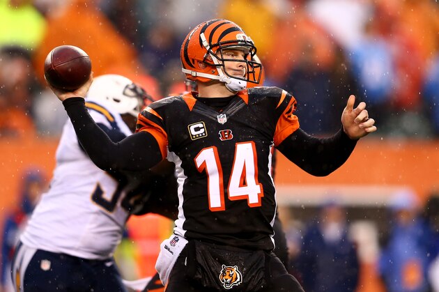 CINCINNATI, OH - JANUARY 05:  Quarterback Andy Dalton #14 of the Cincinnati Bengals passes against the San Diego Chargers during a Wild Card Playoff game at Paul Brown Stadium on January 5, 2014 in Cincinnati, Ohio.  (Photo by Andy Lyons/Getty Images)