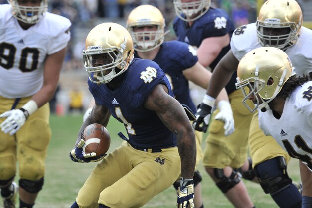 Notre Dame running back Greg Bryant heads up field during the Blue Gold game an  NCAA football game marking the end of spring practice at Notre Dame Stadium Saturday April 12, 2014 in South Bend, Ind. (AP Photo/Joe Raymond)