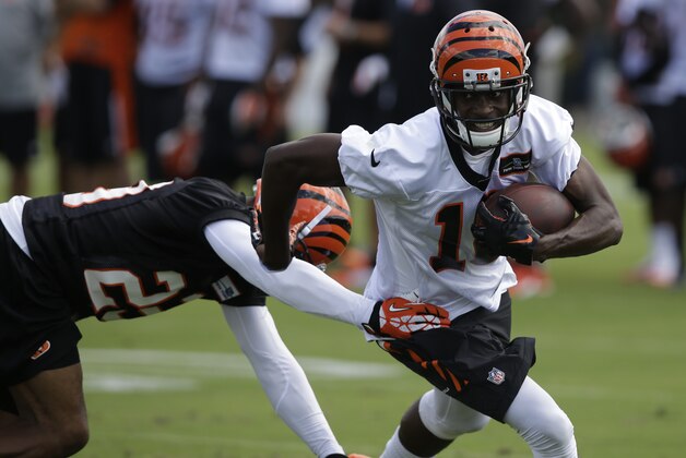 Cincinnati Bengals wide receiver A.J. Green (18) runs the ball during the NFL football team's first practice at training camp, Thursday, July 24, 2014, in Cincinnati. (AP Photo)