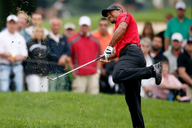 AKRON, OH - AUGUST 03:  Tiger Woods hits out of the rough on the second hole during the final round of the World Golf Championships-Bridgestone Invitational at Firestone Country Club South Course on August 3, 2014 in Akron, Ohio.  (Photo by Gregory Shamus/Getty Images)