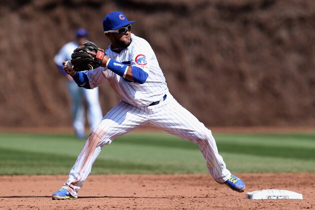 CHICAGO, IL - APRIL 18: Emilio Bonifacio #64 of the Chicago Cubs throws to first base against the Cincinnati Reds at Wrigley Field on April 18, 2014 in Chicago, Illinois. The Reds defeated the Cubs 4-1.(Photo by Jonathan Daniel/Getty Images)