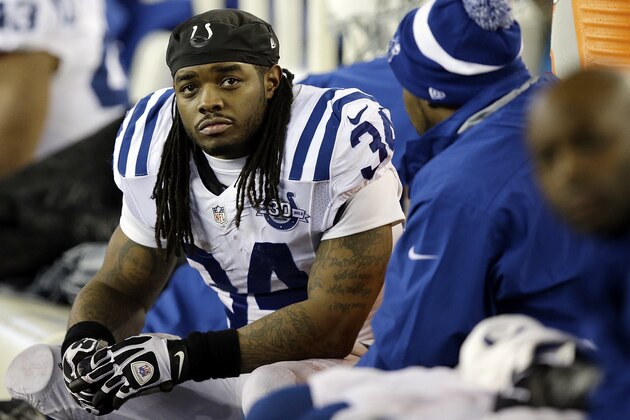 Indianapolis Colts running back Trent Richardson (34) watches the action from the bench during the second half of an AFC divisional NFL playoff football game against the New England Patriots in Foxborough, Mass., Saturday, Jan. 11, 2014. (AP Photo/Stephan Savoia)