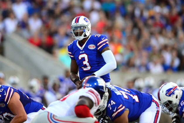 Aug 3, 2014; Canton, OH, USA; Buffalo Bills quarterback EJ Manuel (3) prepares to take a snap from center during the first quarter of the 2014 Pro Football Hall of Fame game against the New York Giants at Fawcett Stadium. Mandatory Credit: Andrew Weber-USA TODAY Sports
