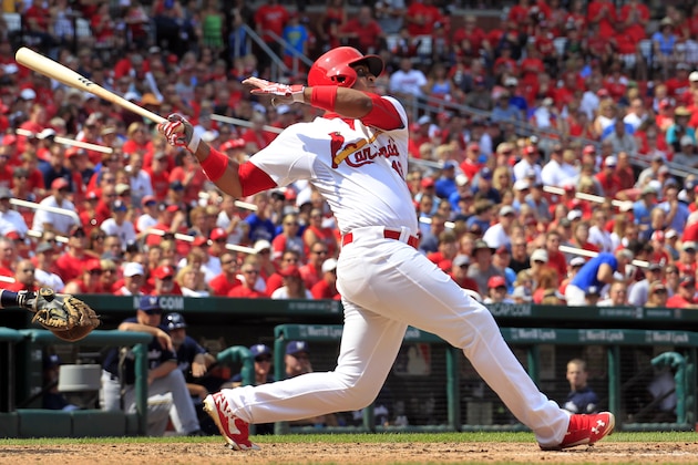 St. Louis Cardinals' Oscar Taveras hits an RBI single to score Jhonny Peralta during the seventh inning of a baseball game against the Milwaukee Brewers Sunday, Aug. 3, 2014, in St. Louis. The Cardinals won 3-2. (AP Photo/Jeff Roberson)