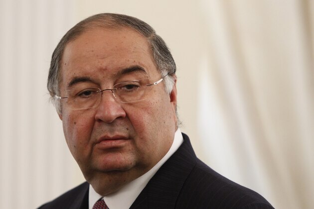 Uzbek-born Russian businessman Alisher Usmanov  attends the meeting of Russian President Vladimir Putin and Crown Prince Sheik Mohammed bin Zayed Al Nahyan of the United Arab Emirates at the Novo-Ogaryovo state residence outside Moscow, on Thursday, Sept. 12, 2013. (AP Photo/Maxim Shemetov)