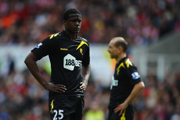 STOKE ON TRENT, ENGLAND - MAY 13:  Dedryck Boyata (25) and Martin Petrov of Bolton Wanderers look dejected during the Barclays Premier League match between Stoke City and Bolton Wanderers at Britannia Stadium on May 13, 2012 in Stoke on Trent, England.  (Photo by Laurence Griffiths/Getty Images)