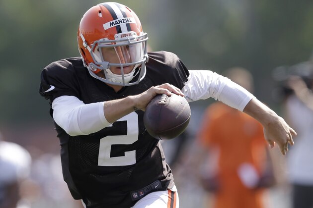Cleveland Browns quarterback Johnny Manziel runs during practice at the NFL football team's training camp Monday, Aug. 4, 2014, in Berea, Ohio. Manziel has taken his first snaps in training camp with Cleveland's starters. Manziel is trying to beat out Brian Hoyer for the starting job. The former Heisman Trophy winner from Texas A&M had worked exclusively with Cleveland's second-string offense until Monday. (AP Photo/Tony Dejak)