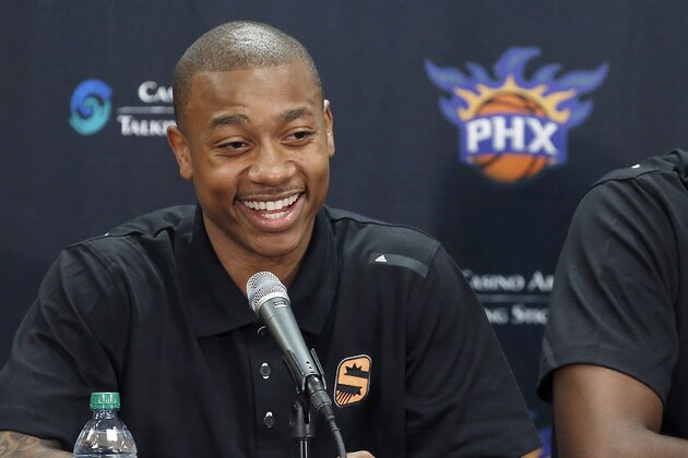 The Phoenix Suns new players Isaiah Thomas, left, and Anthony Tolliver speak as the two basketball players are introduced by the team on Monday, July 21, 2014, in Phoenix. (AP Photo/Ross D. Franklin)