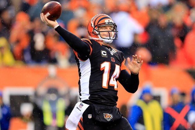 CINCINNATI, OH - JANUARY 05:  Quarterback Andy Dalton #14 of the Cincinnati Bengals passes against the San Diego Chargers during a Wild Card Playoff game at Paul Brown Stadium on January 5, 2014 in Cincinnati, Ohio.  (Photo by Rob Carr/Getty Images)