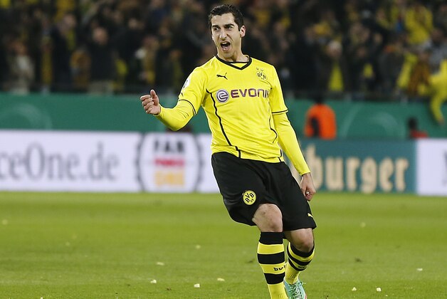 Dortmund's Henrikh Mkhitaryan of Armenia celebrates after scoring during the German soccer cup (DFB Pokal) semifinal match between BvB Borussia Dortmund and VfL Wolfsburg Tuesday, April 15, 2014 in Dortmund, Germany. (AP Photo/Frank Augstein)